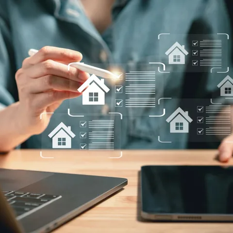 A hand using a stylus to review a digital property checklist